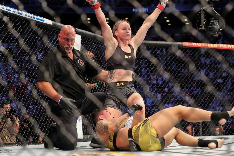 Valentina Shevchenko (right) celebrates after beating Jessica Andrade during the Women’s Flyweight Title bout of UFC 261 at VyStar Veterans Memorial Arena in Jacksonville, Florida. - AFP pic