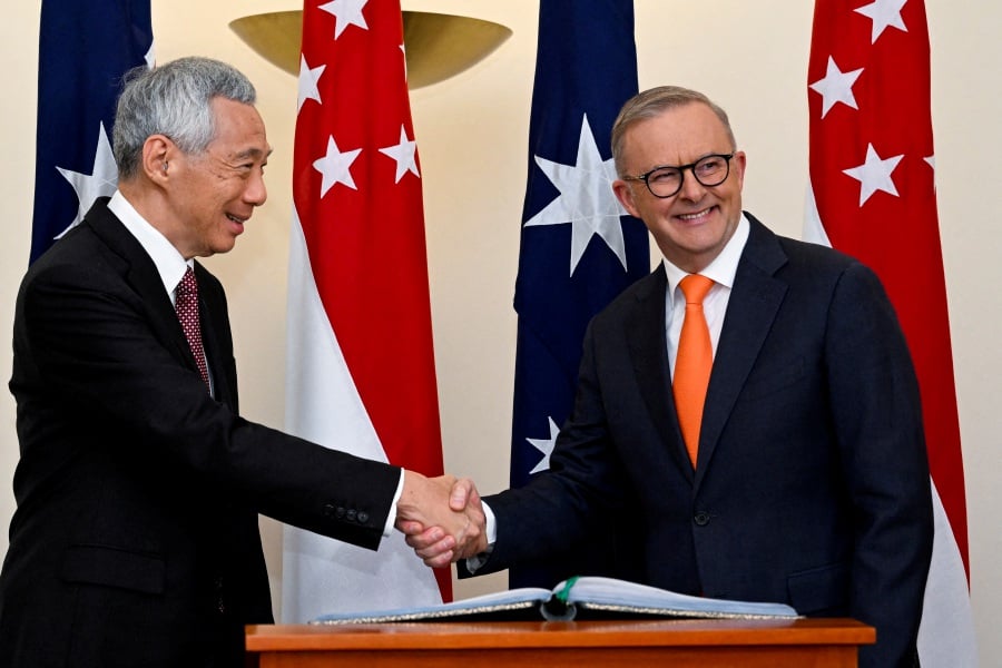 Singapore Prime Minister Lee Hsien Loong (left) will attend the Asean-Australia Special Summit and the 9th Singapore-Australia Annual Leaders’ Meeting from March 4 to 6 in Melbourne, Australia. - Reuters file pic
