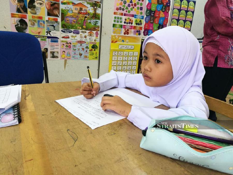Nur Zahirah Aisyah, 7, of Kampung Sungai Jerneh is the sole pupil in Year One. - NSTP/RIZANIZAM ABDUL HAMID