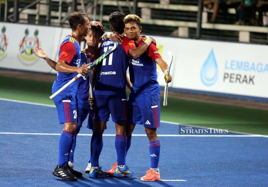 Sarjit Singh celebrated his first official victory as the national hockey coach when Malaysia thrashed Canada 6-2 in their second Sultan Azlan Shah (SAS) Cup match at the Azlan Shah Stadium, Ipoh, on Sunday. - NSTP/L.MANIMARAN