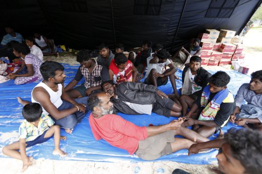 Migrants in Indonesia boat stand-off brought ashore | New Straits Times ...