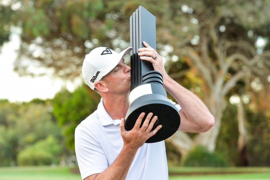 Brendan Steele of the US celebrates with the winner's trophy after the final round of LIV Golf Adelaide at the Grange Golf Club in Adelaide. - AFP PIC