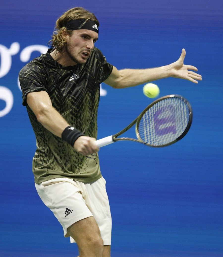 Stefanos Tsitsipas of Greece hits a return to Andy Murray of Great Britain during their match on the first day of the US Open Tennis Championships the USTA National Tennis Center in Flushing Meadows, New York, USA, 30 August 2021. The US Open runs from 30 August through 12 September. - EPA/JUSTIN LANE