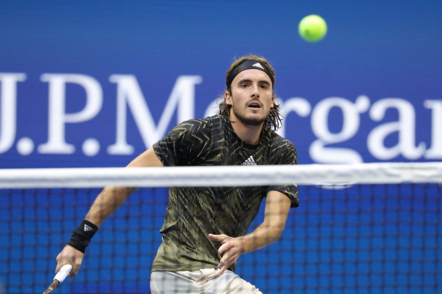 Greece's Stefanos Tsitsipas returns the ball to Spain's Carlos Alcaraz during their 2021 US Open Tennis tournament men's singles third round match at the USTA Billie Jean King National Tennis Center in New York. - AFP pic