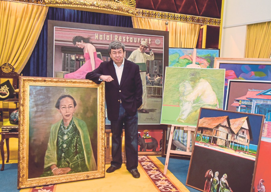 Sultan of Selangor Sultan Sharafuddin Idris Shah standing among some of the 33 paintings which will be showcased at Galeri Prima.