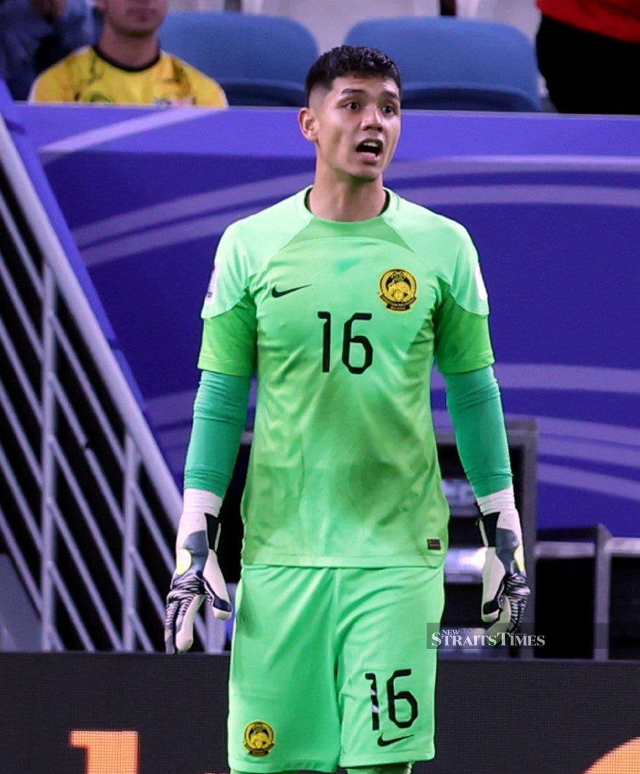 Harimau Malaya’s No.1 goalkeeper Syihan Hazmi has garnered praise from various quarters, not just for his agility but also for his looks, following his performance in the final Group E match of the 2023 AFC Asian Cup in Qatar. - NSTP/HAIRUL ANUAR RAHIM