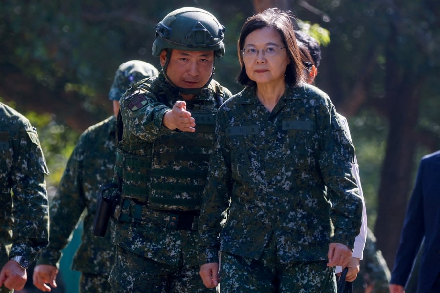 (FILE PHOTO) Taiwan's President Tsai Ing-wen listens to a briefing at a military camp that will be one of the training grounds for the new one year compulsory military service starting earlier next year in Taichung, Taiwan. (REUTERS/Ann Wang/File Photo)