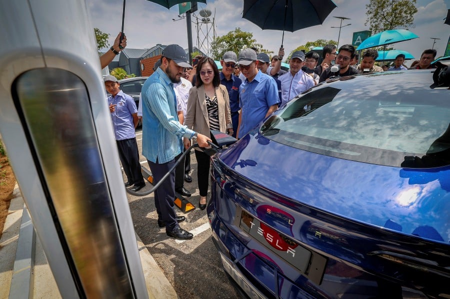 Tengku Zafrul (right) said to date a total of 2,020 EV charging stations are in operation nationwide.