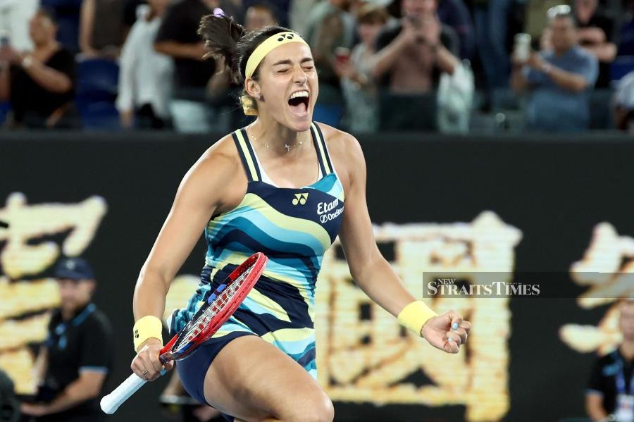 France's Caroline Garcia celebrates winning against Japan's Naomi Osaka at the Australian Open in Melbourne on Monday. AFP PIC