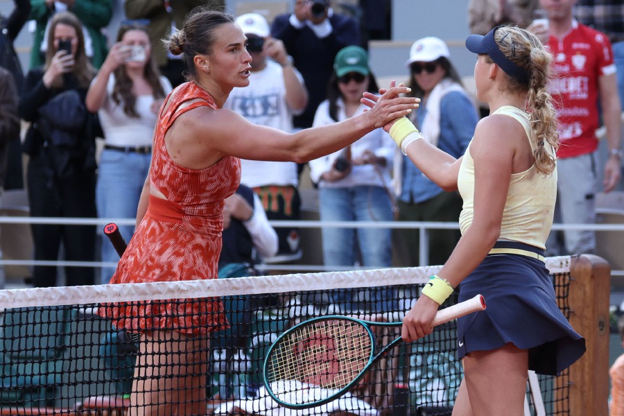 Russia's Mirra Andreeva shakes hands with Belarus' Aryna Sabalenka (L) after winning their women's singles quarter final match on Court Philippe-Chatrier on day eleven of the French Open tennis tournament at the Roland Garros Complex in Paris on June 5, 2024. AFP PIC