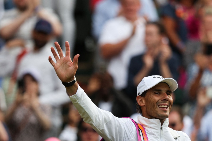 Spain's Rafael Nadal waves as he leaves the court after winning against US player Taylor Fritz during their men's singles quarter final tennis match on the tenth day of the 2022 Wimbledon Championships at The All England Tennis Club in Wimbledon, southwest London. - AFP pic
