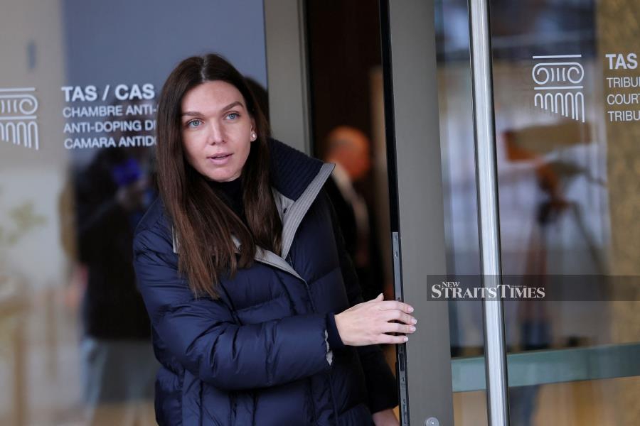 Tennis player Simona Halep of Romania leaves after a hearing for a doping case against her at the Court of Arbitration for Sport (CAS) in Lausanne, Switzerland, on Friday. REUTERS PIC 