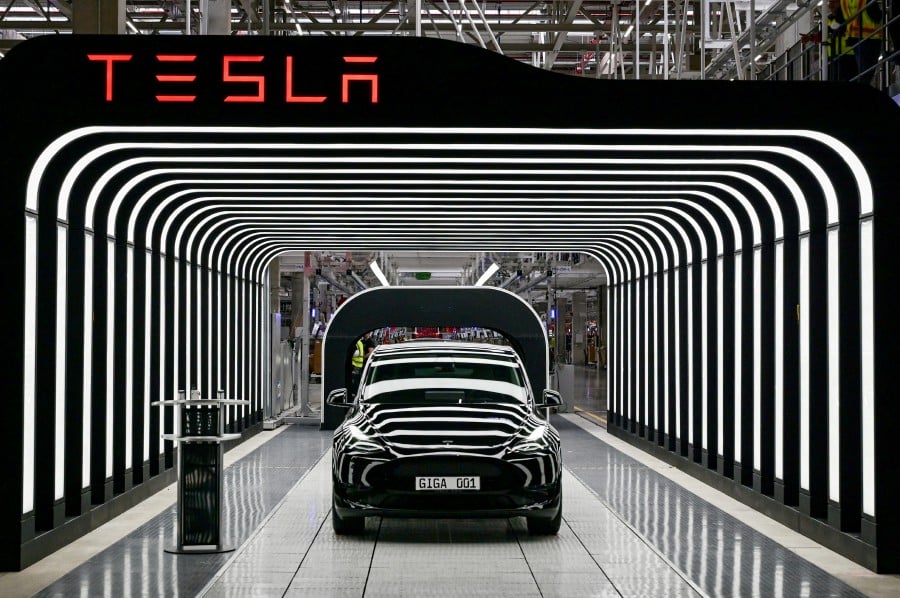 A team from Tesla is expected to visit India later this month to look at sites for a local car manufacturing plant that would require an investment of about $2 billion. -- Reuters photo