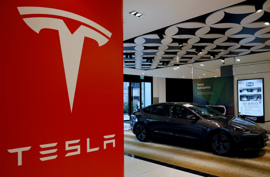 Tesla wants to begin with a showroom of 3,000 to 5,000 sq ft as well as a service hub in each city. -- Reuters photo