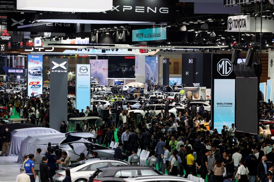 The EV newcomers showcased their cars and technology at slick booths shoulder-to-shoulder with those from market leaders like Toyota Motor that are household names in Southeast Asia’s second-largest economy. -- Reuters photo