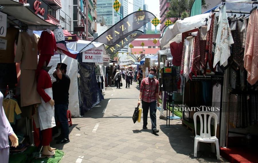 Traders at the Jalan Tuanku Abdul Rahman bazaar are generally voicing discontent over diminished sales compared to prior years. - STR/GENES GULITAH