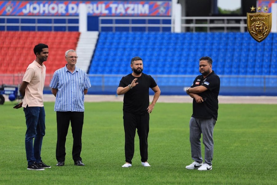 JDT owner Tunku Ismail Sultan Ibrahim (second from right) inspecting the installation of the new hybrid pitch at the Larkin Stadium on Tuesday. - Pic courtesy from JDT Facebook