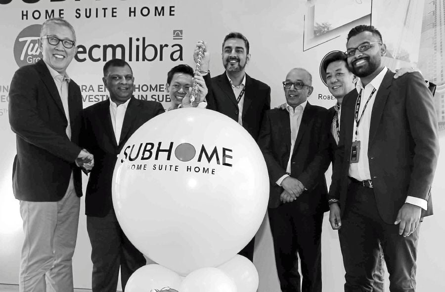 ECM Libra Financial Group Bhd managing director Lim Kian Onn, Tune Group Sdn Bhd co-founder Tan Sri Dr Tony Fernandes, SubHome co-founder Michael Tan, SubHome CEO Sandeep Singh Grewal, ECM Libra Financial Group chairman Datuk Seri Kalimullah Hassan, Tune Hotels CEO Mark Lankester and SubHome COO Aravind Sinniah pose for a photocall at the launch of their partnership. NSTP photo by SAIFULLIZAN TAMADI