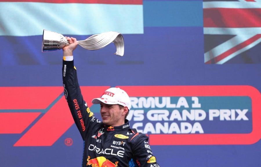 Red Bull Racing's Dutch driver Max Verstappen celebrates on the podium after winning the 2024 Canada Formula One Grand Prix at Circuit Gilles-Villeneuve in Montreal, Canada, on June 9, 2024. AFP PIC