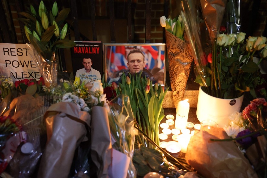 Photographs, flowers and lit candles are left outside the Russian Embassy in London, following the news of the death of Russian opposition leader Alexei Navalny. British Foreign Secretary David Cameron on Friday said that Russian President Vladimir Putin "should be accountable for what has happened", following news of the death of opposition leader Alexei Navalny. - AFP pic