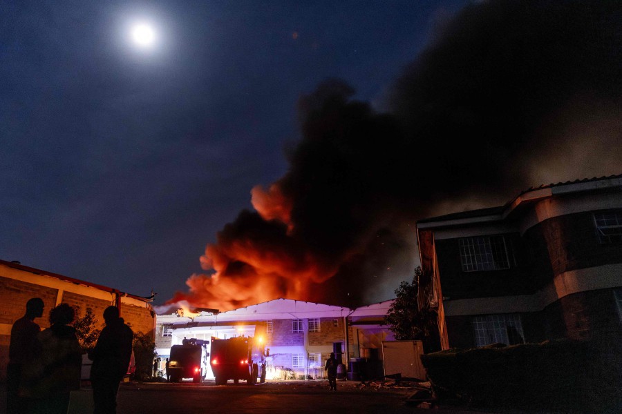 Firemen fight a blaze following a series of explosions in the Embakasi area of Nairobi, Kenya on February 2, 2024. At least 30 people have been transferred to different hospitals, according to the Kenya Red Cross, after explosions rocked an industrial and residential area of the Kenyan capital. AFP PIC