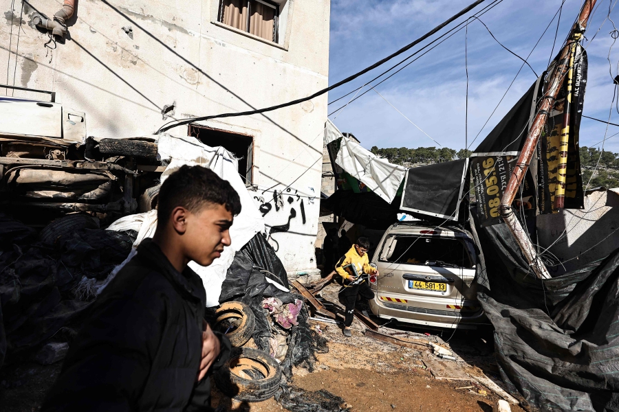 Palestinians inspect the damage after an Israeli raid in the Nur Shams camp for Palestinian refugees near the northern city of Tulkarm in the occupied West Bank. (Photo by Zain JAAFAR / AFP)