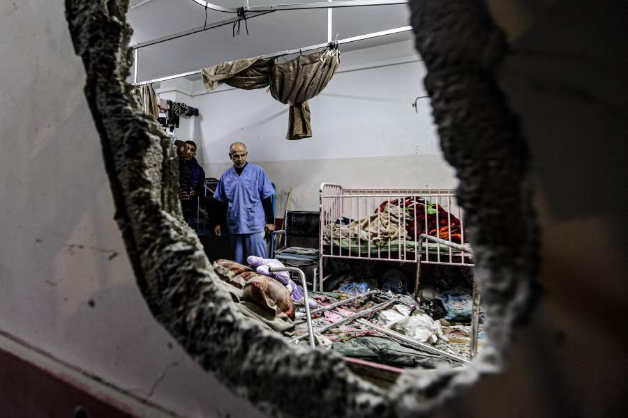 People inspect the damage in a room following Israeli bombardment at Nasser hospital in Khan Yunis in the southern Gaza Strip on December 17, 2023. - AFP pic