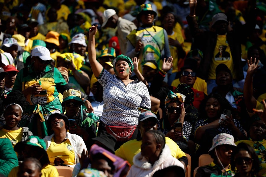 African National Congress (ANC) supporters sing and chant during the party�s Siyanqoba Rally at FNB Stadium in Johannesburg on May 25, 2024 ahead of the country's upcoming national and provincial elections on May 29, 2024. AFP