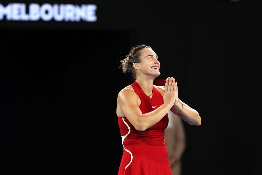 Belarus' Aryna Sabalenka reacts after her victory against USA's Coco Gauff after their women's singles semi-final match on day 12 of the Australian Open tennis tournament in Melbourne. (Photo by Martin KEEP / AFP) 
