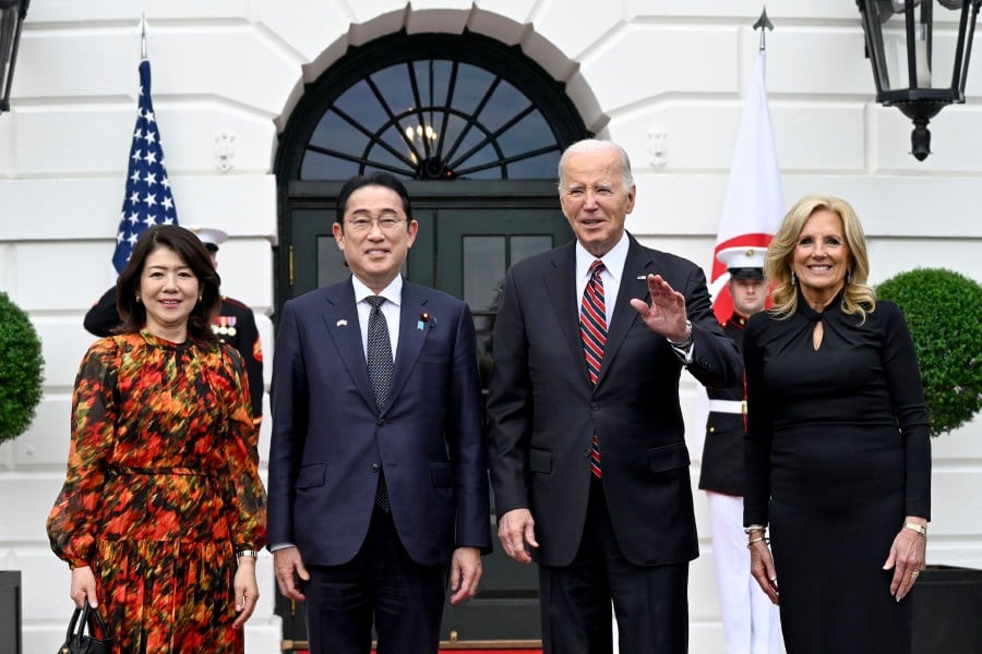 US President Joe Biden and First Lady Jill Biden pose as they welcome Japan's Prime Minister Fumio Kishida and his spouse Yuko Kishida at the South Portico of the White House in Washington, DC, on April 9, 2024. Photo by ANDREW CABALLERO-REYNOLDS / AFP