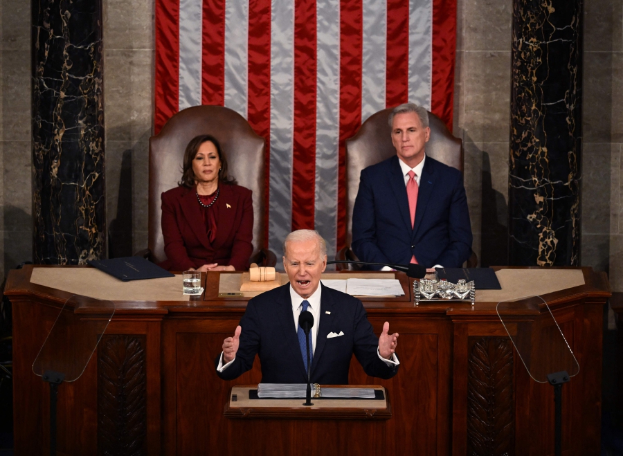 US Vice President Kamala Harris (top, left) and US Speaker of the House Kevin McCarthy (top, right) listen as US President Joe Biden (centre) delivers the State of the Union address in the House Chamber of the US Capitol in Washington, DC. (Photo by ANDREW CABALLERO-REYNOLDS / AFP)