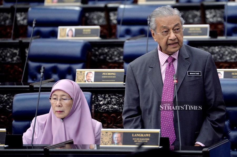 Prime Minister Tun Dr Mahathir Mohamad (left) said those who were currently employed in the gig economy were not able to enjoy benefits such as those who were in permanent positions and were at risk of being mistreated by their employers. BERNAMA 