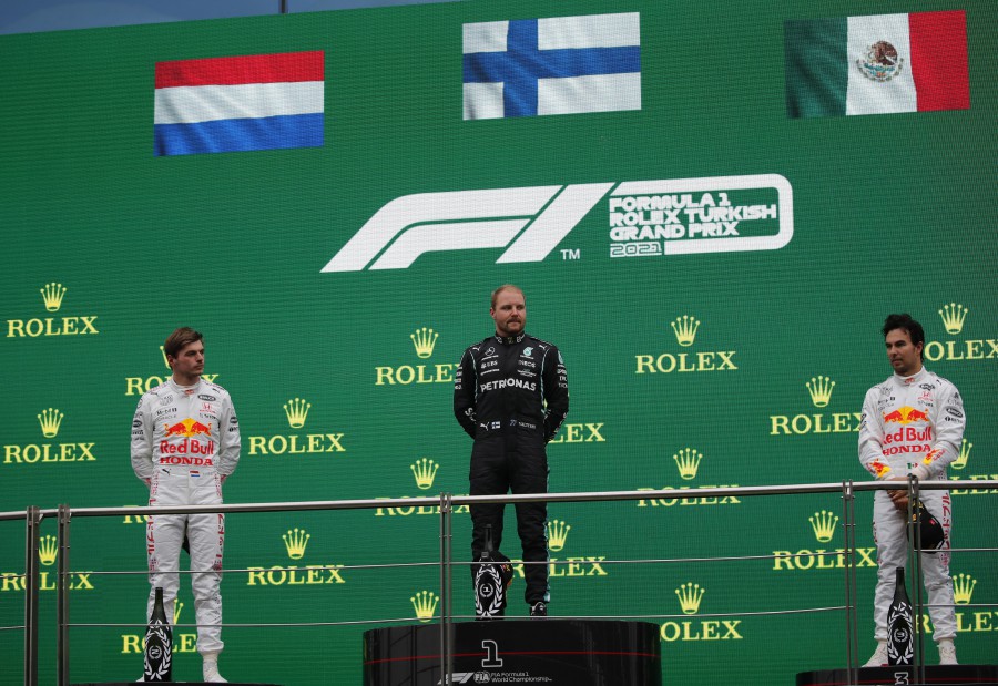 Winner Finnish Formula One driver Valtteri Bottas of Mercedes-AMG Petronas (C), second placed Dutch Formula One driver Max Verstappen (L) of Red Bull Racing and third placed Mexican Formula One driver Sergio Perez (R) of Red Bull Racing on the podium during the award ceremony of Formula One Grand Prix of Turkey at the Intercity Istanbul Park circuit in Istanbul, Turkey, 10 October 2021. EPA pic