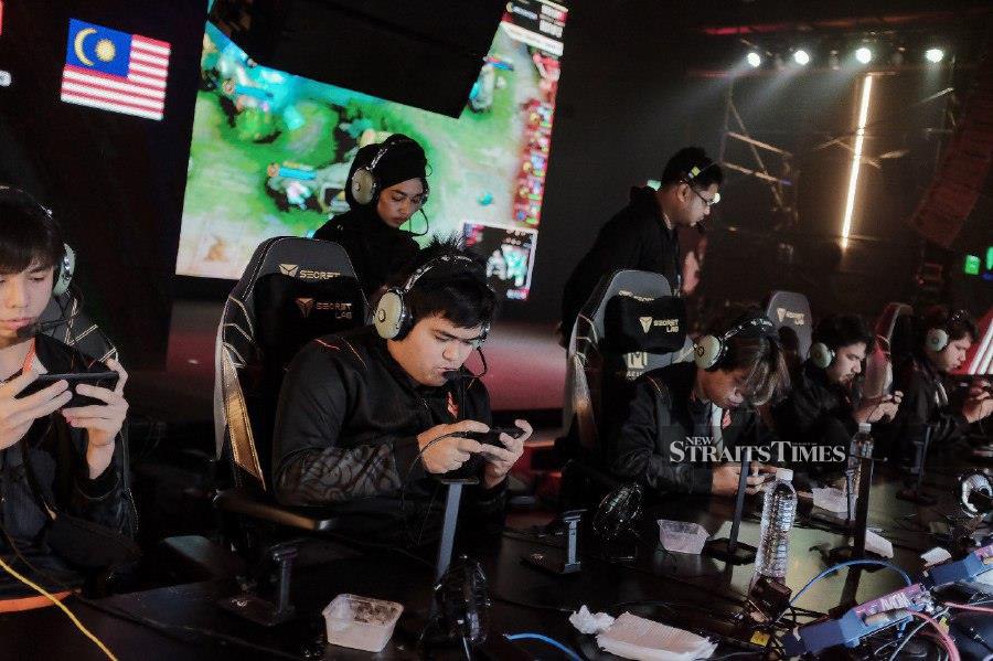 Team SMG players during the match against the Falcon Team from Saudi Arabia at the Mobile Legends: Bang Bang World Championship Wild Card at the JioSpace Arena in Petaling Jaya today. - NSTP/SADIQ SANI