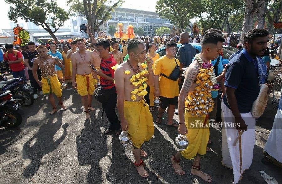 A sea of Hindu and Chinese devotees and foreign tourists thronged Jalan Kebun Bunga/Jalan Air Terjun here, the site for the annual Thaipusam celebration.-NSTP/MIKAIL ONG