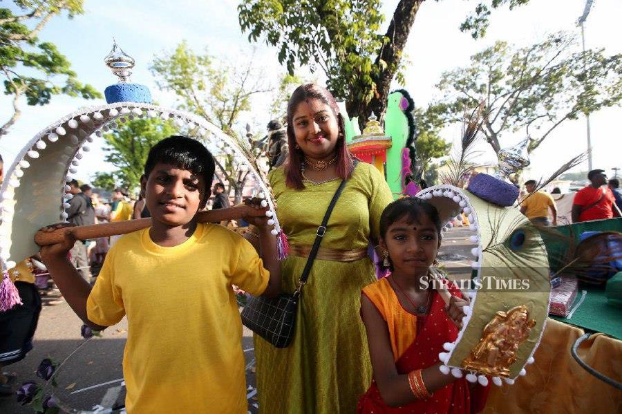 K.Navasshakthi, 35, with her son K.Durrvasan, 10, and daughter K.Tharanny, 7. The children will be carrying the traditional kavadi and small paal kudam during the Thaipusam celebrations. NSTP/MIKAIL ONG