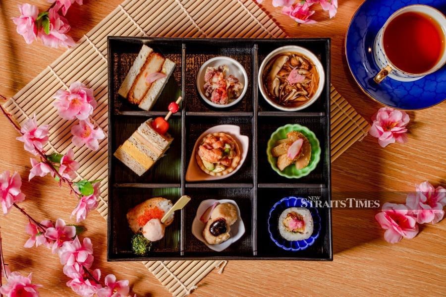 Admiring the beautiful morsels of food in the Hanami Bento