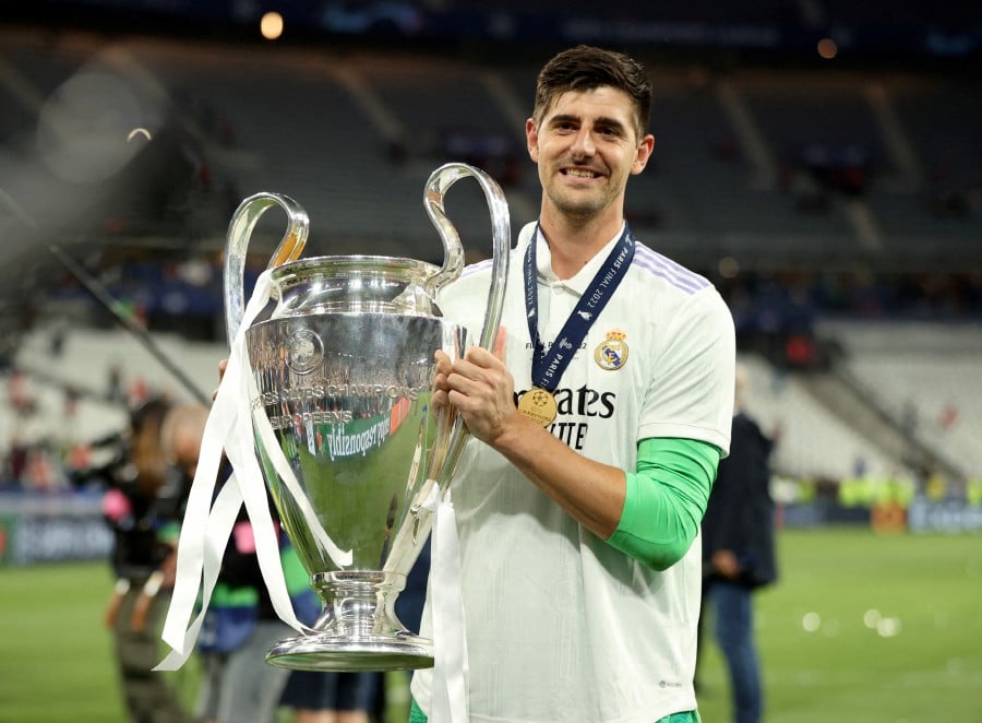 FILE PHOTO: Champions League Final - Liverpool v Real Madrid - Stade de France, Saint-Denis near Paris, France - May 28, 2022Real Madrid's Thibaut Courtois celebrates winning the champions league with the trophy . - REUTERS pic