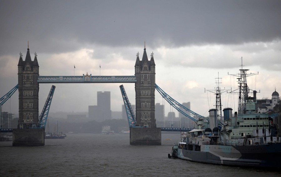 Tower Bridge is pictured, stuck in an open position due to a technical fault, in central London. - AFP PIC