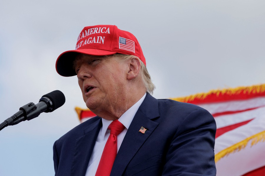 Former President Donald Trump gives remarks at the South Texas International airport in Edinburg, Texas. Trump took the stage shortly after Texas Governor Greg Abbott officially endorsed the former president for his 2024 presidential campaign. - Michael Gonzalez/Getty Images/AFP