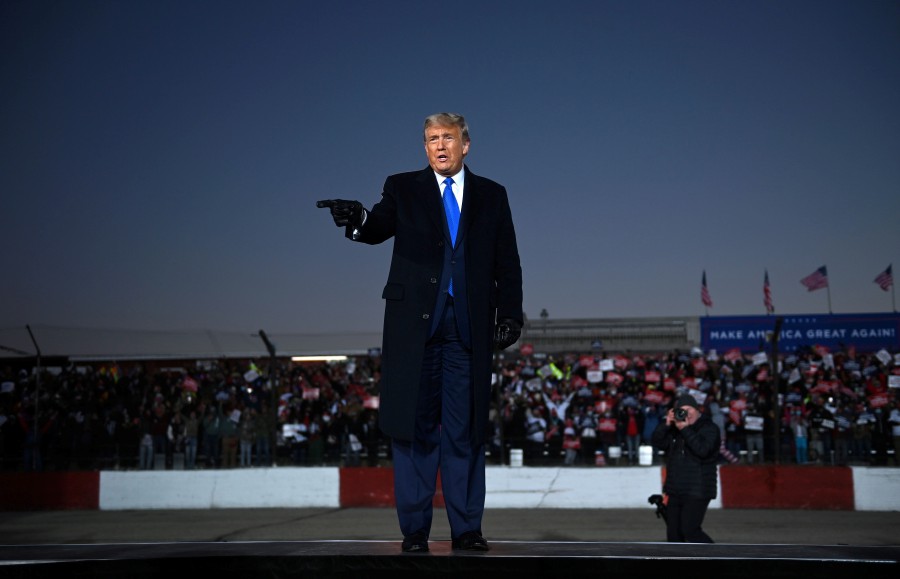 US President Donald Trump gestures as he arrives for a Make America Great Again rally at the La Crosse Fairgrounds Speedway, October 27, 2020, in West Salem, Wisconsin. - AFP pic