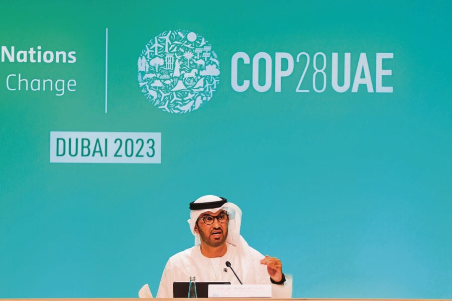 COP28 president Sultan Ahmed Al Jaber speaks during the opening press conference of the United Nations climate summit in Dubai on November 30, 2023. Nearly 200 nations agreed on November 30 to launch a fund to support countries hit by global warming, in a "historic" moment at the start of UN climate talks in the oil-rich UAE. (KARIM SAHIB / AFP)