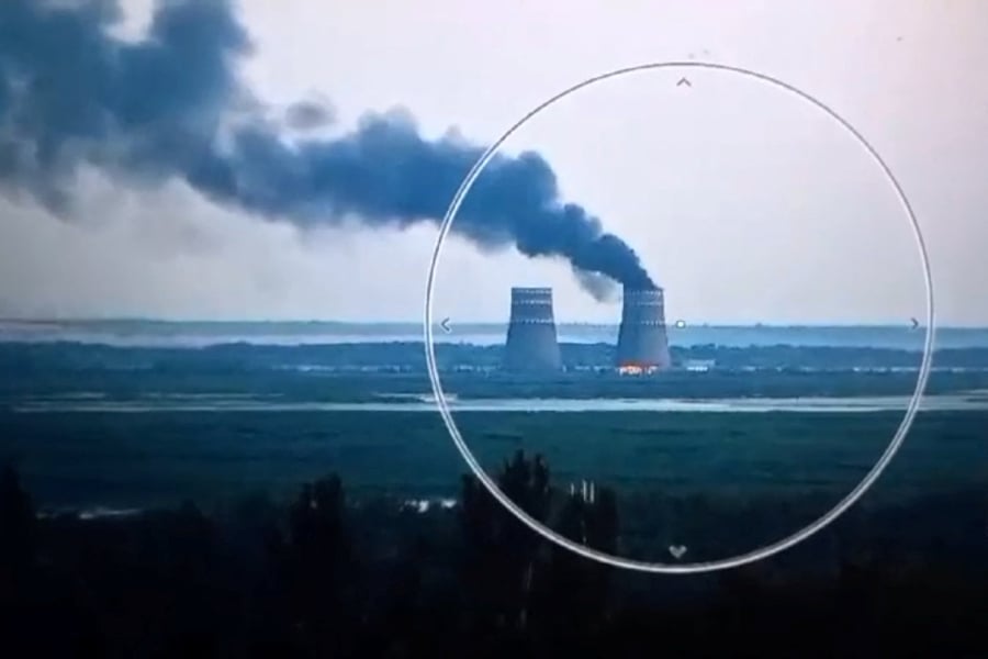 A fire at a cooling tower of the Russian-controlled Zaporizhzhia nuclear power plant in Energodar, Southern Ukraine. (Photo by Handout / UKRAINIAN PRESIDENTIAL PRESS SERVICE / AFP) 