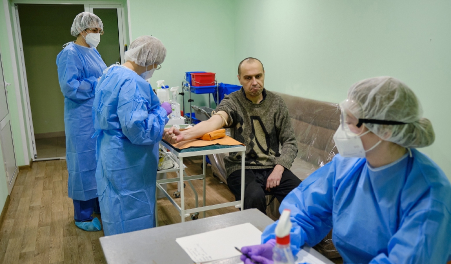 A Ukrainian prisoner having a medical examination at the Mayorske checkpoint in Donetsk region. AFP