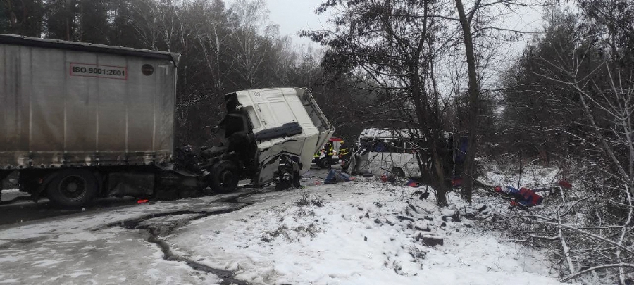 Emergency personnel work at the site of a deadly accident in which a passenger bus collided with a truck, in northern Ukraine on December 7, 2021. (Photo by Handout / State Emergency Service of Ukraine / AFP)  