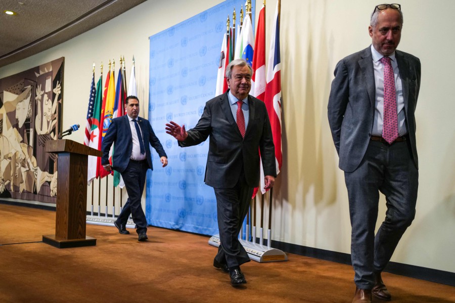 UN Secretary-General Antonio Guterres (C) leaves after speaking to the press at UN headquarters in New York on April 5, 2024, ahead of the six-month mark since the October 7 Hamas attack on Israel. AFP PIC