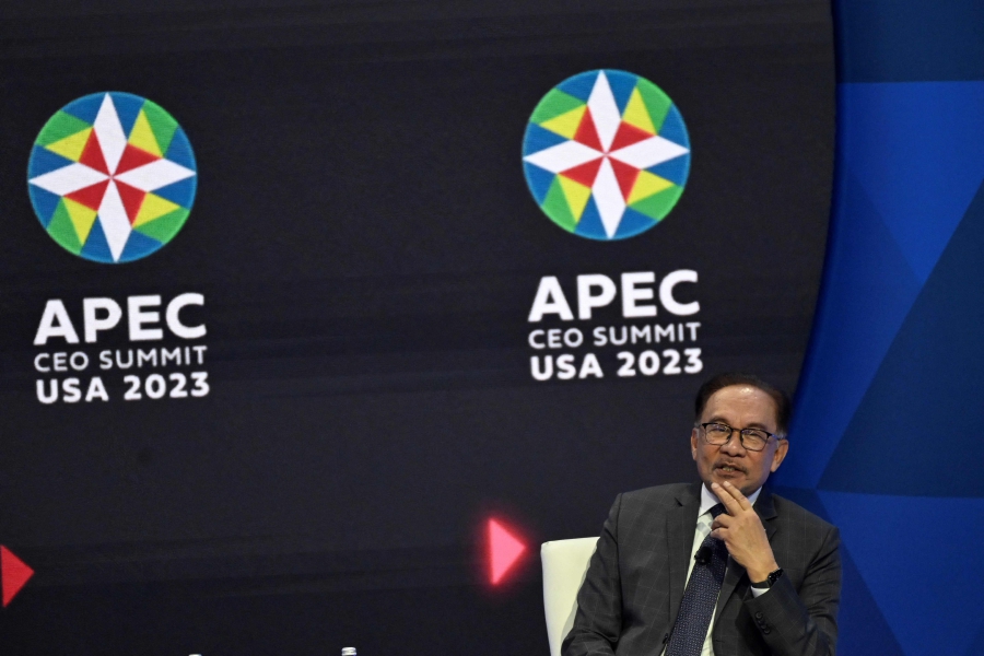 Malaysian Prime Minister Anwar Ibrahim speaks during the The Global Economy and the State of the World conversation at the Asia-Pacific Economic Cooperation (APEC) Leaders' Week in San Francisco, California, (Photo by ANDREW CABALLERO-REYNOLDS / AFP)