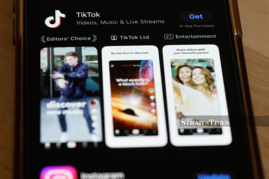 In this photo illustration, the TikTok app is seen in the app store on a phone on March 13, 2024 in New York City. TikTok has said around 60 per cent of ByteDance is owned by institutional investors including US giant BlackRock. ByteDance’s founders have a 20 per cent stake, and the remainder is held by employees, according to TikTok. AFP Pic