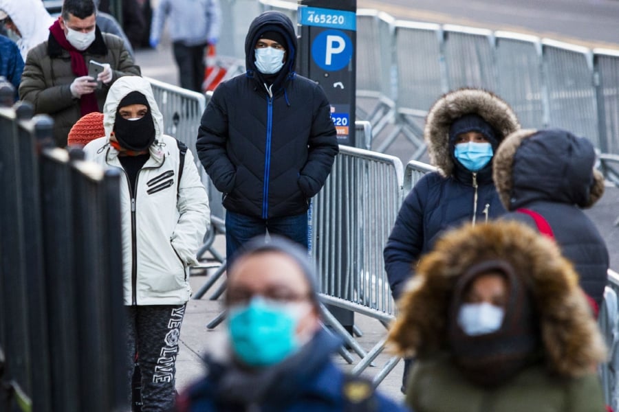 People line up to get a test at Elmhurst Hospital due to coronavirus outbreak on March 24, 2020 in Queens, New York, United States. There are now more than 35,000 cases of COVID-19 in the United States as governments scramble to contain the spread. Eduardo Munoz Alvarez/Getty Images/AFP