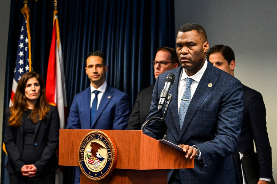 United States Attorney for the Southern District of Florida Markenzy Lapointe speaks during a press conference on former US Ambassador to Bolivia, Victor Manuel Rocha, accused of spying for Cuba, at U.S. Attorney's Office for the Southern District of Florida in Miami. (Photo by CHANDAN KHANNA / AFP)